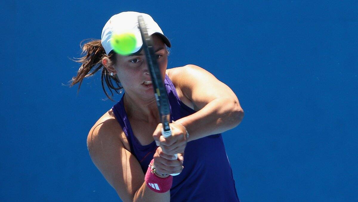 Returning:  Viktorija Rajicic of Australia plays a backhand in her quater-finals match against Jessica Moore of Australia in the Australian Open 2014 Qualifying at Melbourne Park on December 12, 2013 in Melbourne, Australia.  PICTURE: GETTY IMAGES