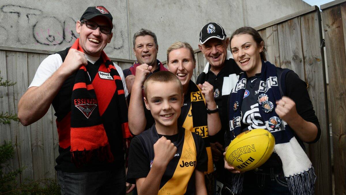 Go team: AFL fans, from left, Leon Underwood, Rodney Owen, Nelson Bawden, Shannon Bawden, Warren Heal and Sarah McGaffin are excited about the start of the season. PIcture: ADAM TRAFFORD