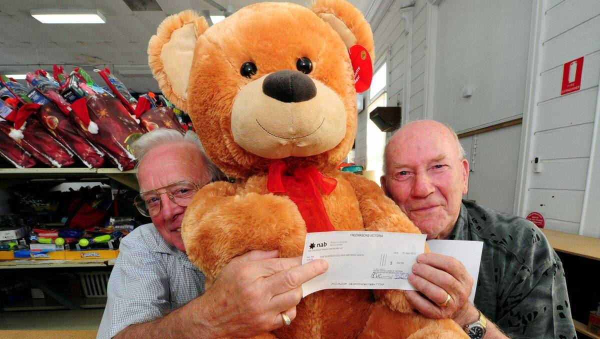 Helping others:  Masons Charlie Pruis and Alan Glasson with their Christmas donation.