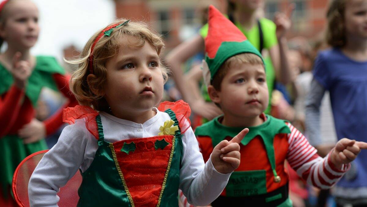 Helpers: Sophia,5, and Oscar Lamont, 3, are dressed up to help Santa. PICTURES: ADAM TRAFFORD