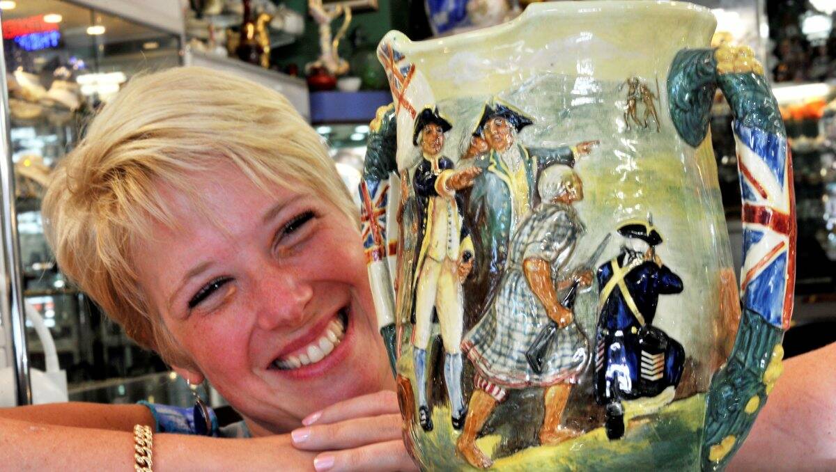 Valuable: Kim-Alexa Sascia from Alexa’s Treasures with a Royal Doulton Captain Cook Loving Cup. PICTURE: JEREMY BANNISTER