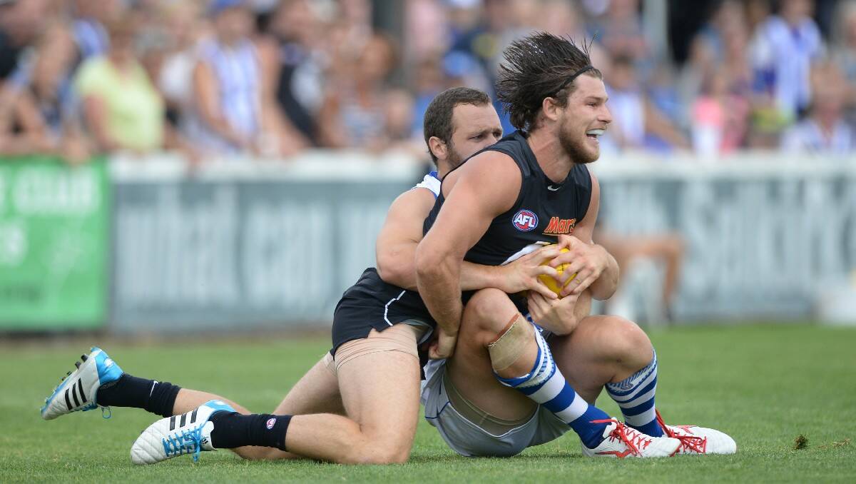 North Melbourne's Scott McMahon and Carlton's Bryce Gibbs playing in the NAB Cup  game at Eureka Stadium.. PIC: KATE HEALY