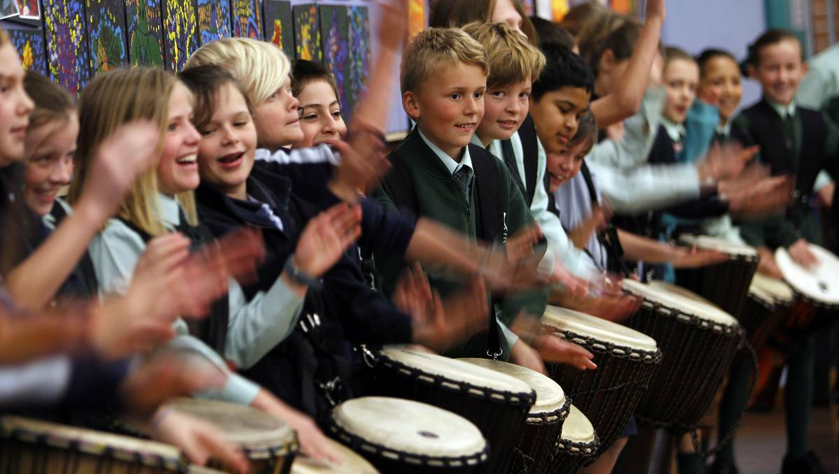 Bailey, 10 (centre) joins the drumming chorus at a multi-school African drumming rehearsal this week in the Illawarra. Picture: Andy Zakeli