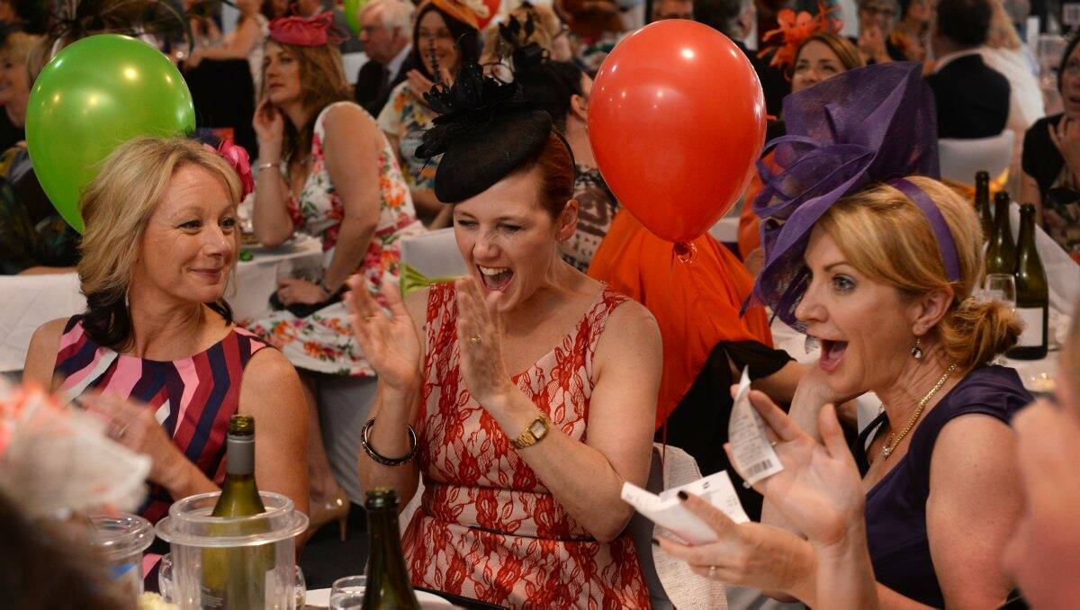 WINNING STYLE: Sarah Condous, Tanya Whiting and Jenni Alizzi celebrate a win during the Fiona Elsey Cancer Research Institute Melbourne Cup luncheon at Ballarat Trotting Club yesterday. PICTURE: ADAM TRAFFORD