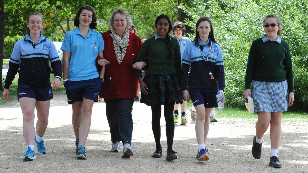 BEST FEET FORWARD: Gail Elsey, whose daughter Fiona passed away from a rare bone cancer, takes a stroll with students Michaela Ingwersen, Violet Gibson, Agnes Benjamin, Kelsey Cook and Natasha Sims as part of yesterday’s Fiona’s Walk around Lake Wendouree. PICTURE: JUSTIN WHITELOCK