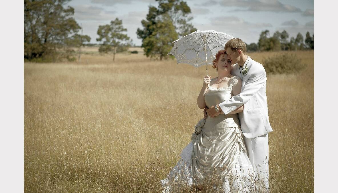 Claire McIntyre and Paul Butler, married on December 29, 2012 at the couple's Smythes Creek property. Family and friends made their food, the cake, the flowers and the dress. The pair honeymooned at Queensland's Heron Island Resort. Photo: Mark and Trudi Photography.