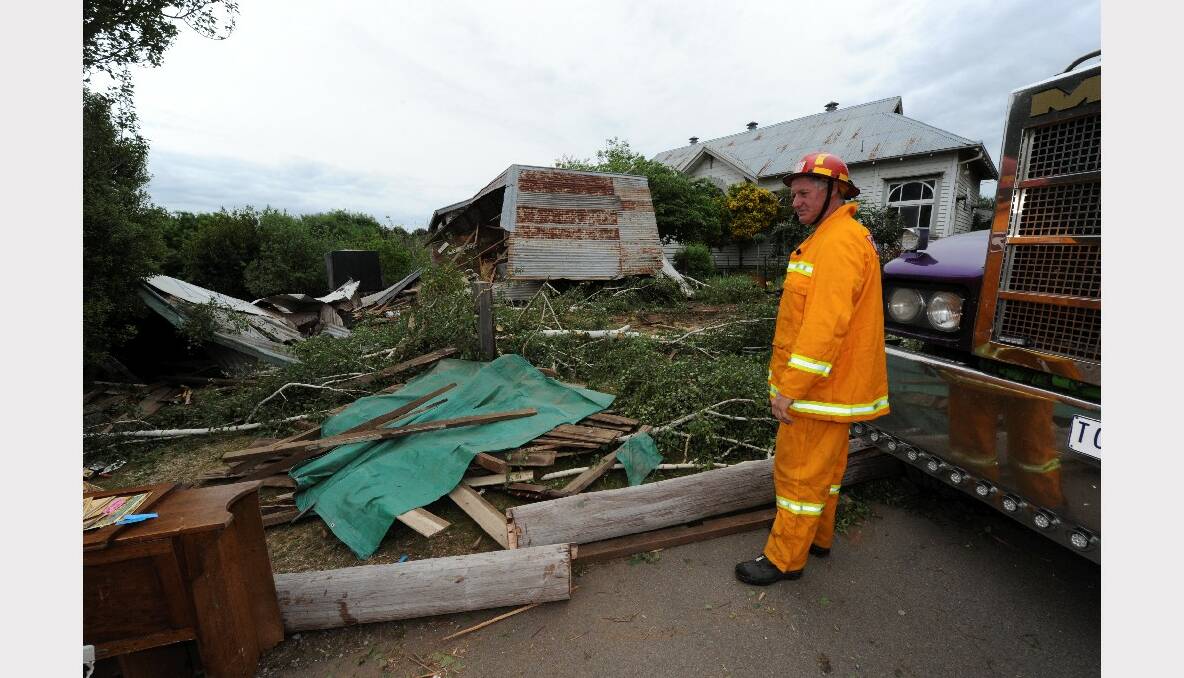 CFA volunteer Dominic Prendergast assessed the damage outside the Newlyn property. PICTURE: JEREMY BANNISTER.