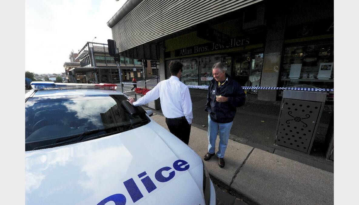Allan Bros owner Bill Allen talks to detectives at the scene. PICTURE: JEREMY BANNISTER.