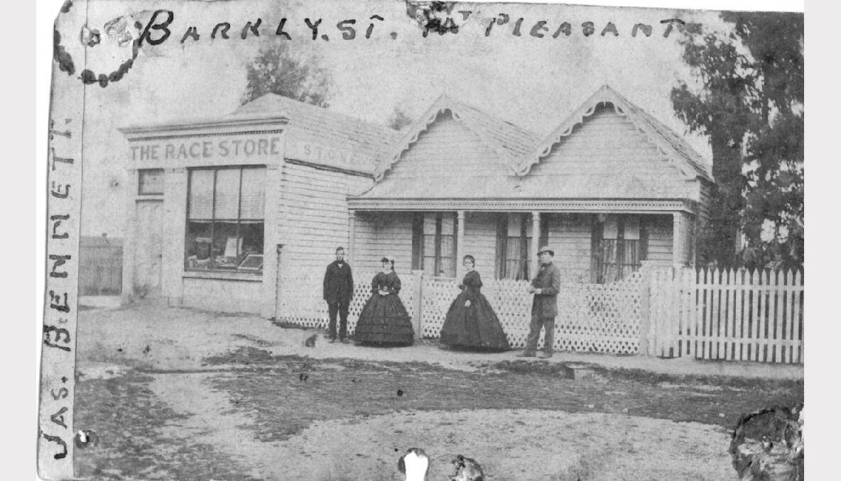 Two men and two women outside a weatherboard building and a shop named "The Race Store", 1860. Fom left: James Harris, his sister Eliza Harris, Mary-Anne Bennet (nee Harris) and her husband and the shop owner, James Bennett. The shop was on the corner of Barkly and Bradshaw Streets. SOURCE: THE BALLARAT HISTORICAL SOCIETY.