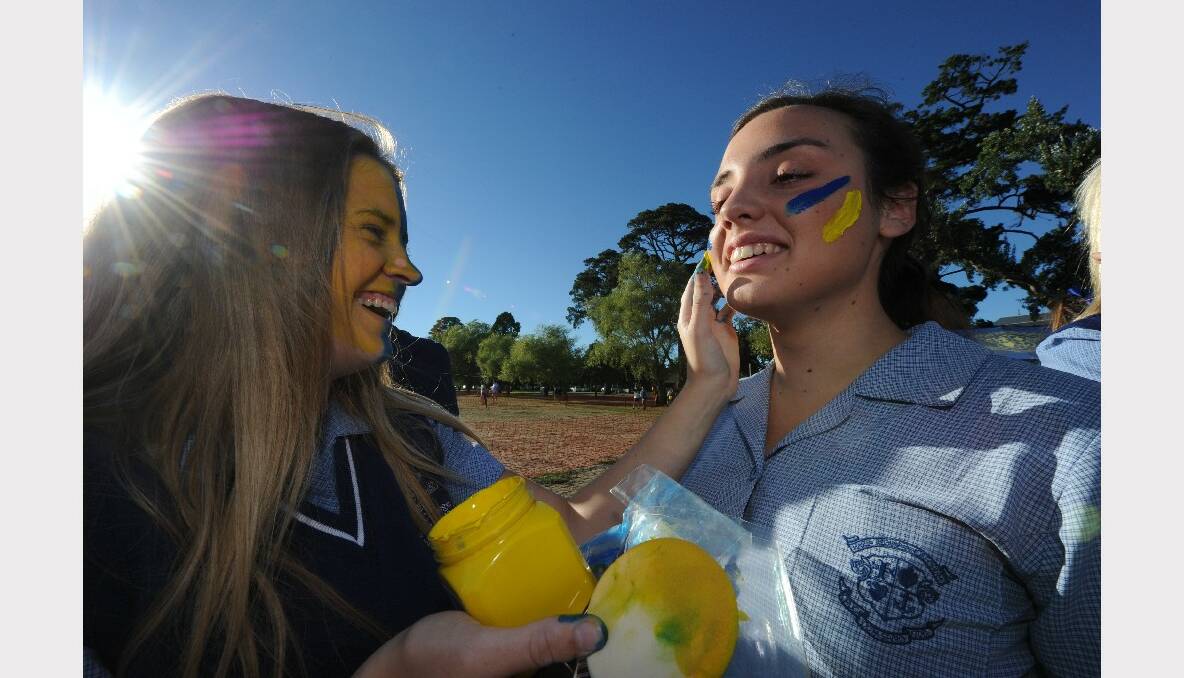 Telisha Fowler and Elise Beynon applying the war paint. PICTURE: JEREMY BANNISTER.