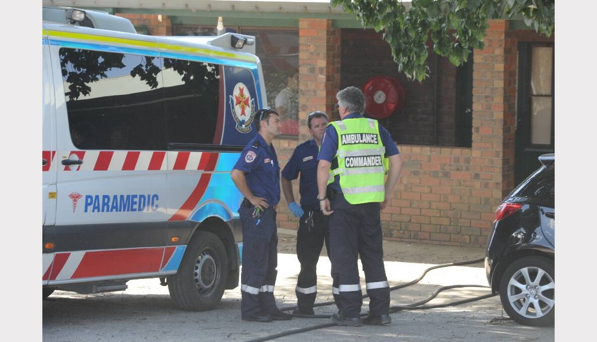 Ambulance crews on scene at Rutherford Park, near where the blaze occurred. PICTURE: LACHLAN BENCE.
