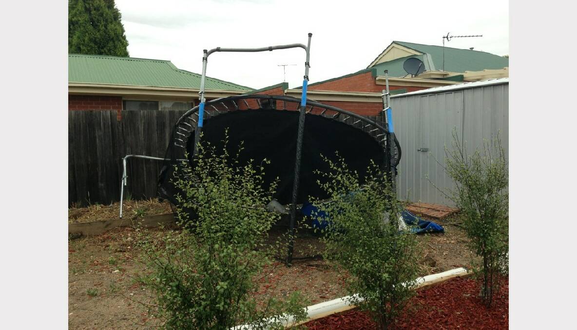 This trampoline blew from three doors down into this backyard. Submitted by Allyssa McArthur.