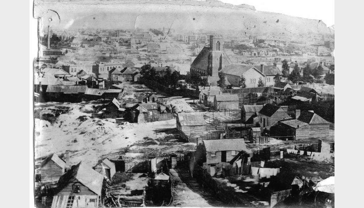 View of Ballarat - St. Paul's Church of England and rough wooden houses. Looking west up Sturt Street. Mount Pleasant as seen from School of Mines SOURCE: THE BALLARAT HISTORICAL SOCIETY.