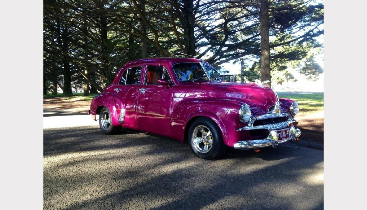 4) "This Holden is raspberry with a wicked paint job, with flames and matching grey and raspberry interior. It has handmade wheels and has been in the family for about 20 years." Submitted by Brett Mould.
