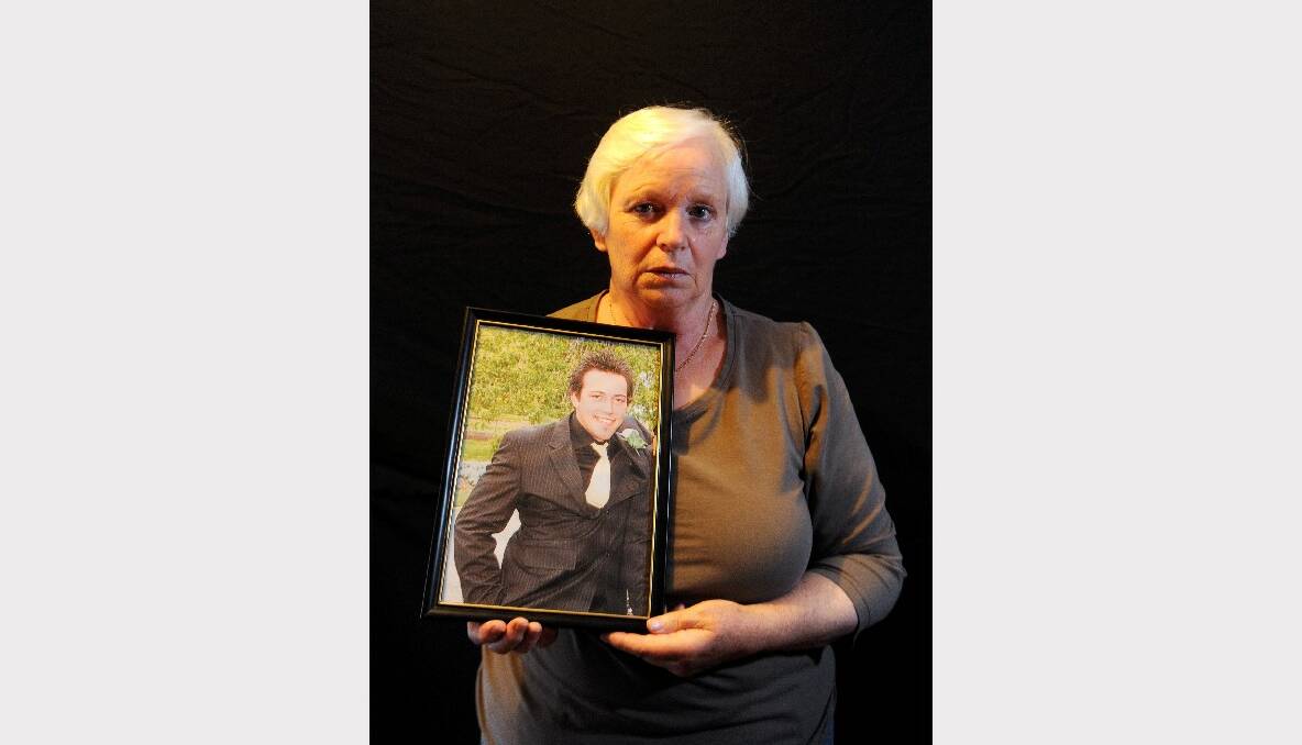 PLEA: Family member Margaret Wapshott with a photo of Troy. The ordeal is "a living nightmare", she says. 