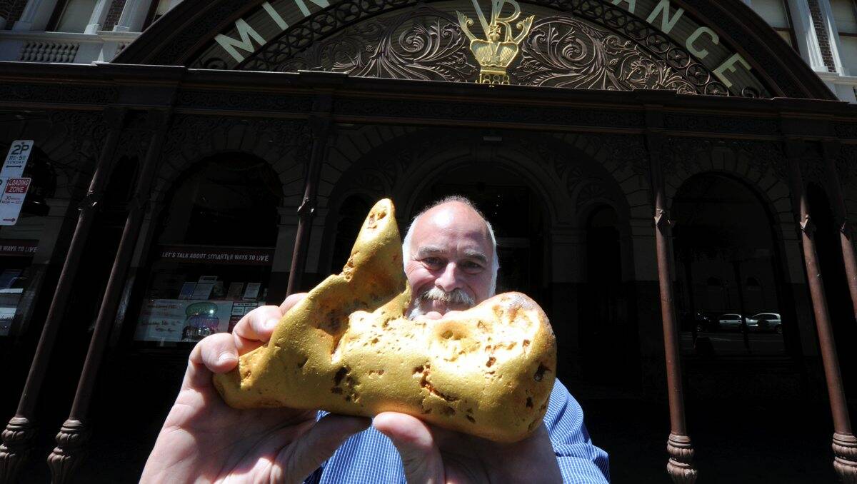 Gold Shop owner Cordell Kent with a replica of the now sold nugget. PICTURE: JEREMY BANNISTER.