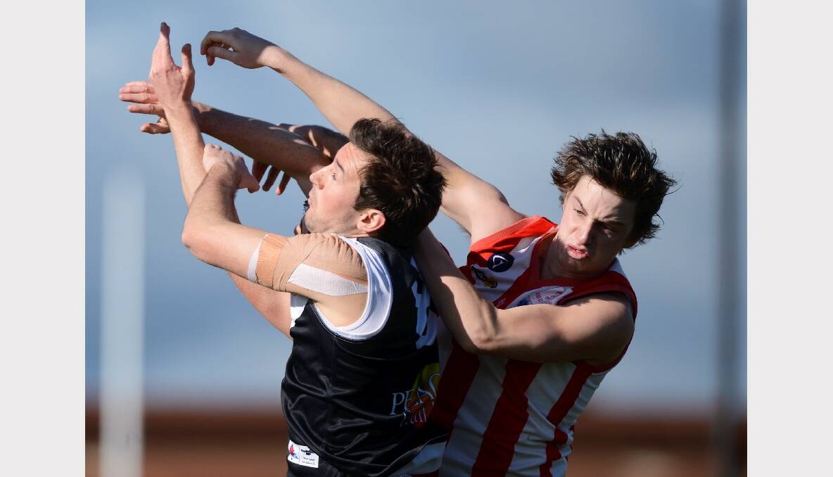 North City's Tristan Cartledge and Ballarat Swan's Jason Payne in the weekend's game at Eureka Stadium. PICTURE: ADAM TRAFFORD. 