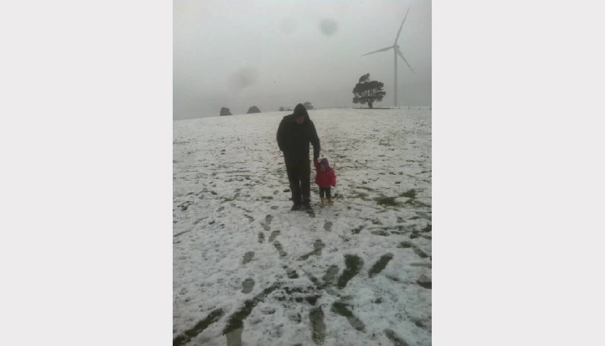 My one year old niece Charlotte Isabelle Lemmon playing in the snow in Daylesford with her dad Anthony Lemmon for his birthday. Submitted via The Courier iPhone App.