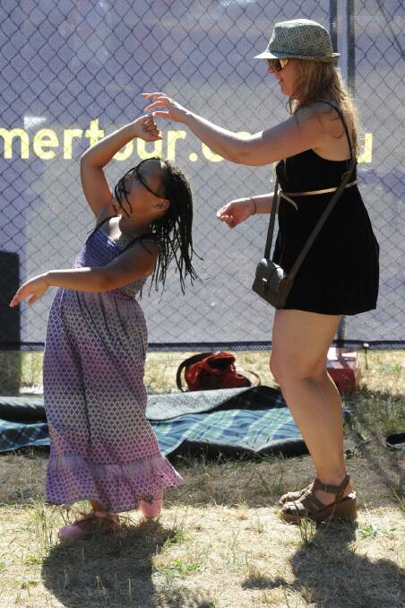 7 year old Jonisha Tapera and Michelle Tapera at the Red Hot Summer Tour. PIC: Lachlan Bence