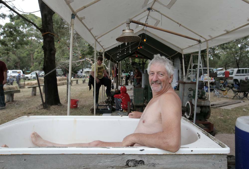 Orford vintage engine display event organiser Terry Rowbottom in an engine powered shower/bath. Picture: AARON SAWALL