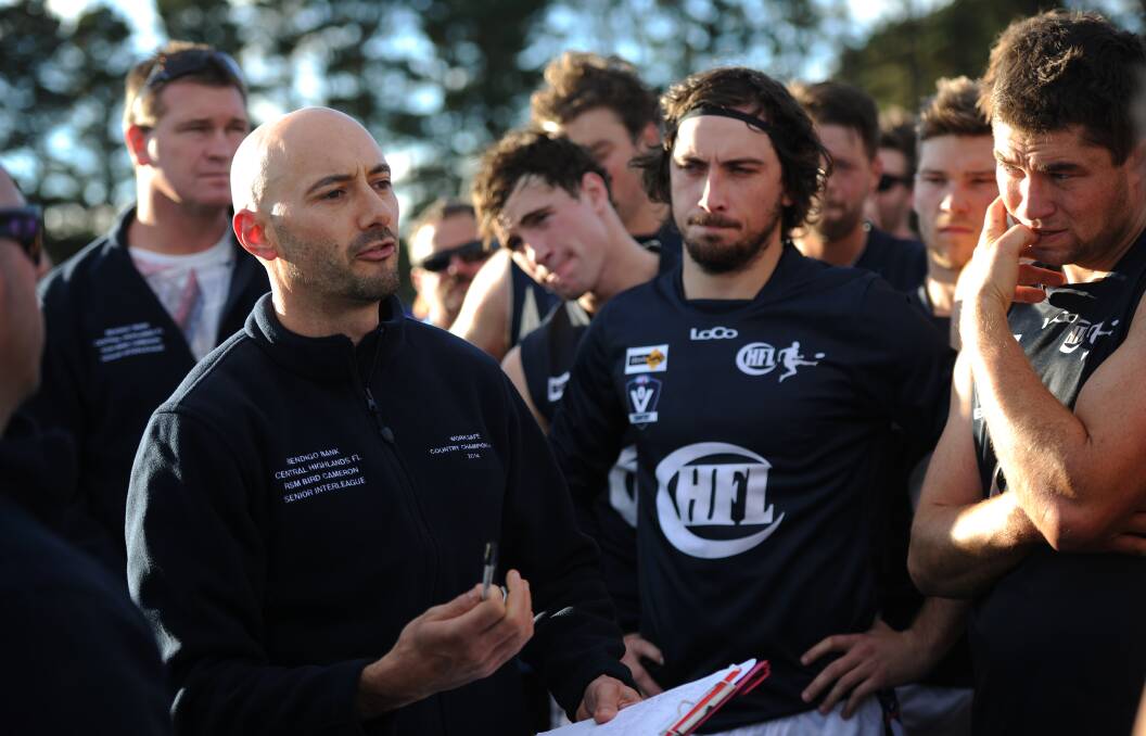 Greg Middleton addresses his troops at last year's country championships.