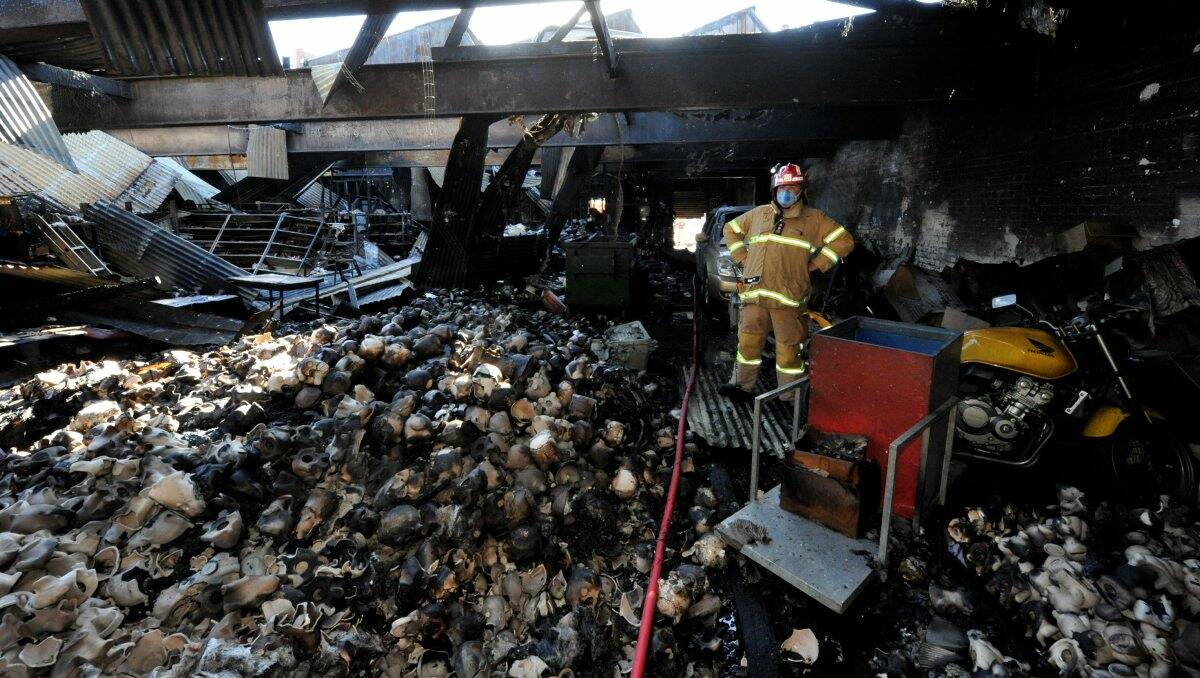 Fire crews inspect the damage inside what was the Plaster Fun House in Ballarat. PIC: Jeremy Bannister