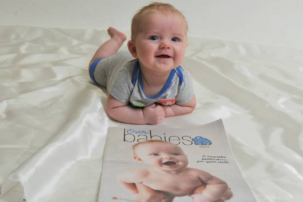 Jack checking out his good work on the front cover of Our Babies magazine. Pick up The Courier for your copy today. PIC: Lachlan Bence