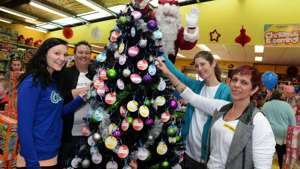 Casey Johnston (Curves), Rachel Daniel (Centacare), Santa, Linda Smith (Centacare) and Sue Fothergill (Manager of Toyworld) Launch of Centacare Christmas toy drive appeal.