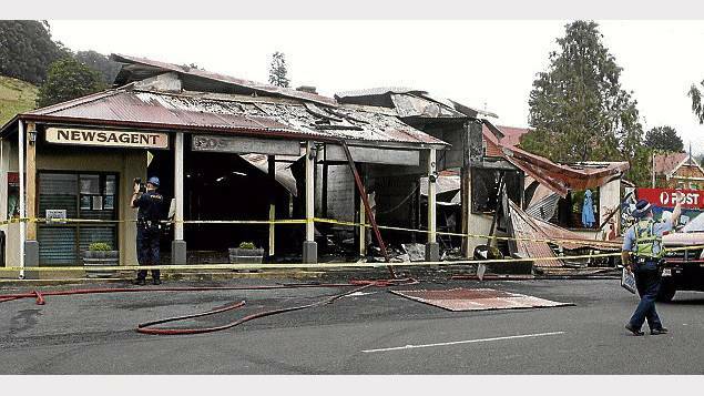 The scene of the $600,000 fire which destroyed the original Coles store at Wilmot early yesterday morning.