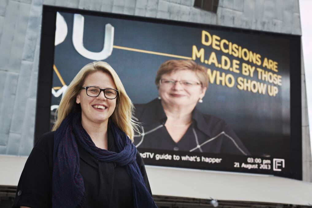 Festival director Lisa Dempster at Federation Square with a MADE director Jane Smith on the screen. PICTURE: SUPPLIED