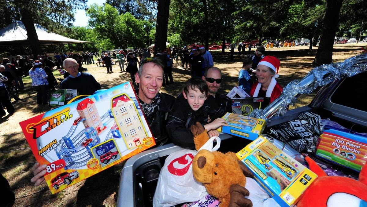 Andy, Simon and Ian Keefe deliver their presents on the Toy Run. PIC: Jeremy Bannister