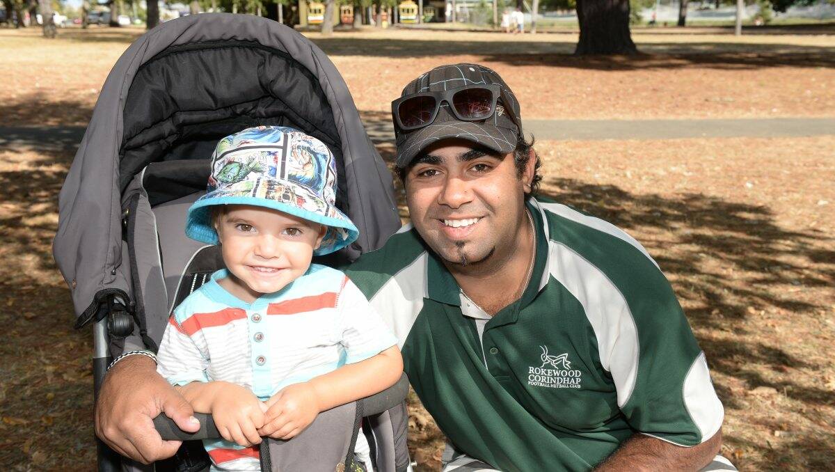 Charlie Clarke, 2, and Aaron Clarke at The Courier Begonia Parade. PICTURE: KATE HEALY