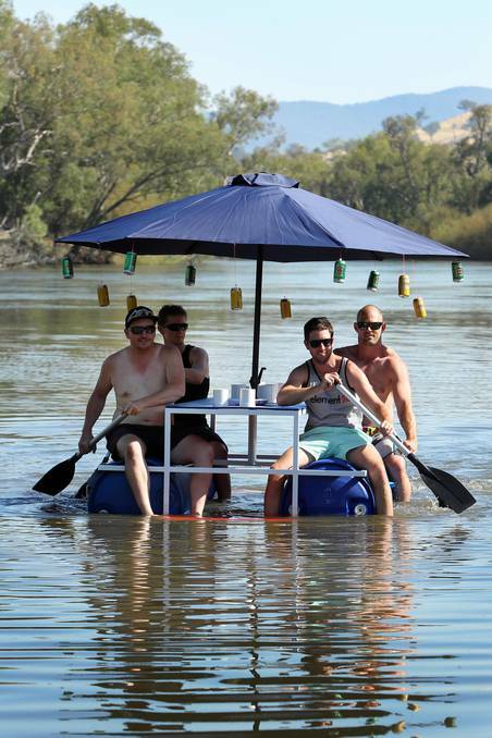 These boys have come up with a floating picnic table ready for Australia Day on the Murray River.