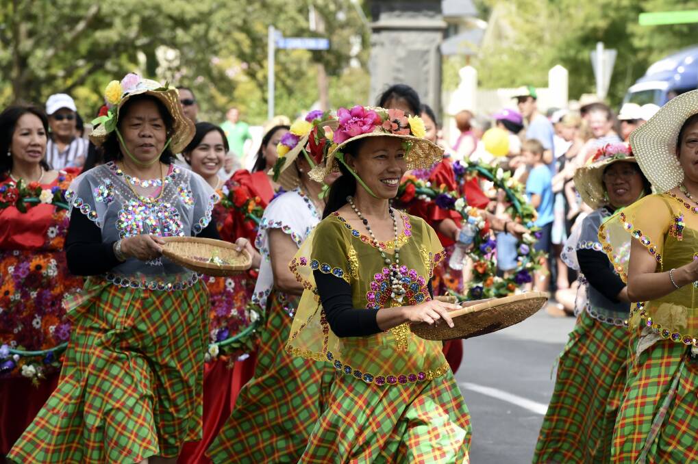 Brenda McMahon leading the Filipino Australian Association of Ballarat at The Courier Begonia Parade. PICTURE: JEREMY BANNISTER