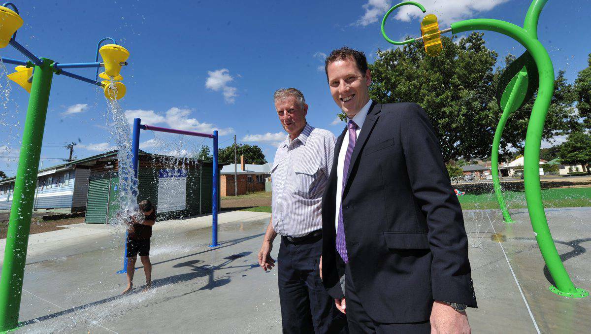 Ballarat mayor Josh Morris and Councillor John Phillips inspect a new water spray park, which converts into a basketball court in the winter.