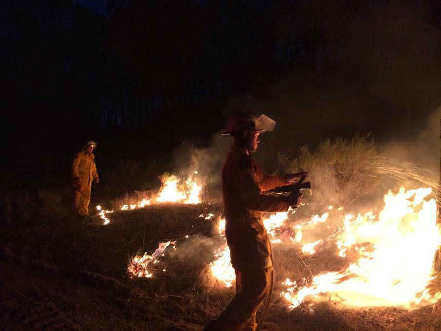 Firefighters battle the flames on Saturday night during the Lindon Park blaze near Perthville. Photo: BATHURST BRIGADE 