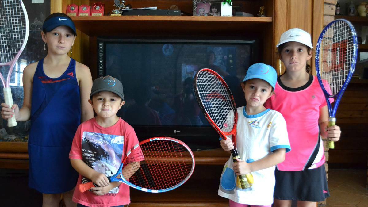 South coast tennis fans Emily (10), Aiden (4), Chloe (6) and Jasmine (7) Beetson from Bomaderry can’t think of anything worse than missing the Australian Open on television.