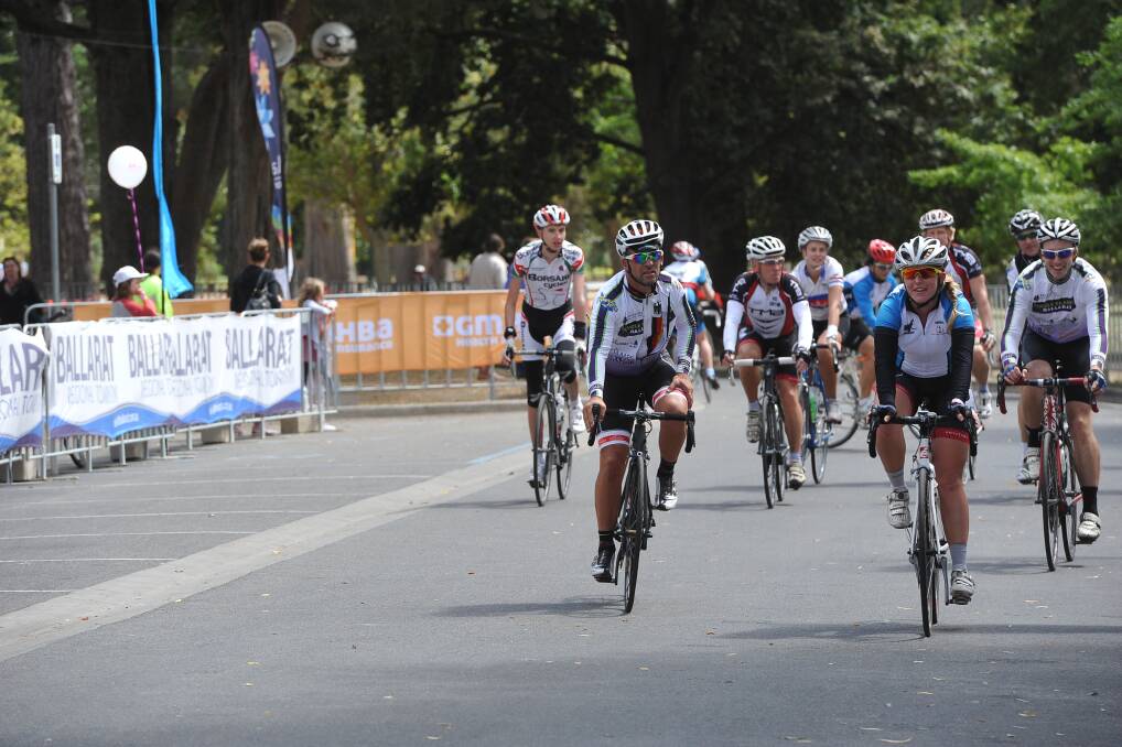 Road cyclists cross the line. PIC: Lachlan Bence