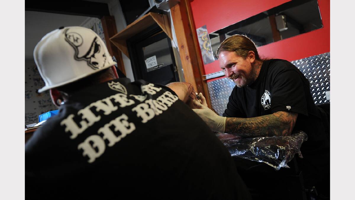 Crusty Demons member Seth Enslow guest artist tattooing at Tattoos Ink PHOTO:ADAM TRAFFORD