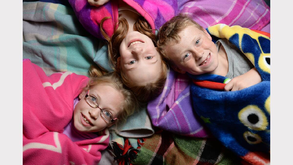 St Patricks Primary School have held a blanket drive to donate blankets to St. Vincent de Paul. Grade 2/3 students Ruby Delaney, Ted O'Brien & Laura Banks PHOTO:ADAM TRAFFORD