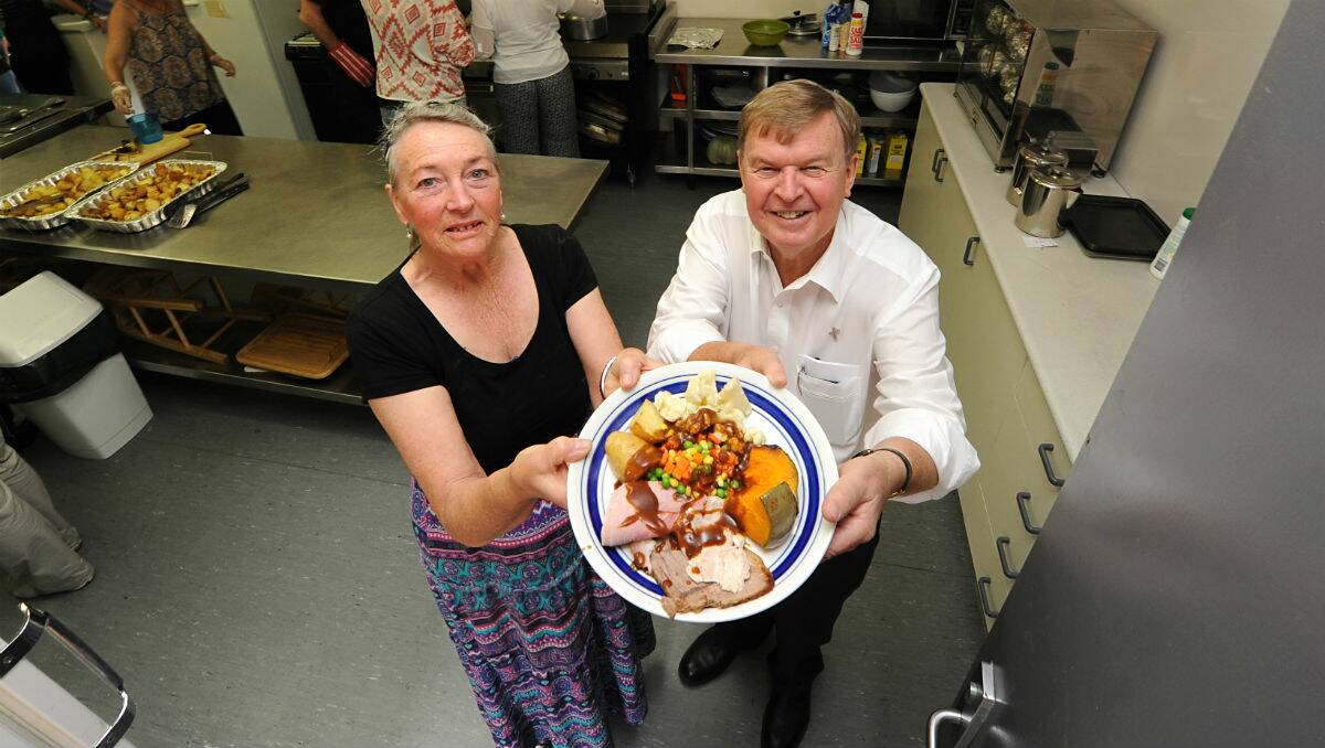 Lyn Janes and Father Tomas Brophy at the Our Lady Help of Christians Christmas lunch. PICTURE: JUSTIN WHITELOCK