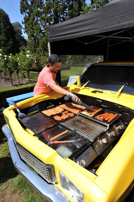 Ben Burga (Correct) cookin' up some bangers on his HX BBQ PIC: JEREMY BANNISTER 