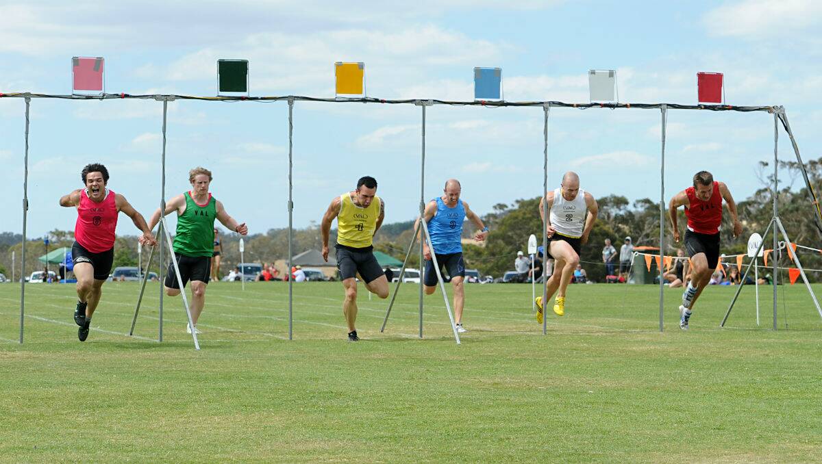 Marty Sinclair, in pink, far left, crossing the line at Cricket Willow this afternoon. PICTURE: JUSTIN WHITELOCK