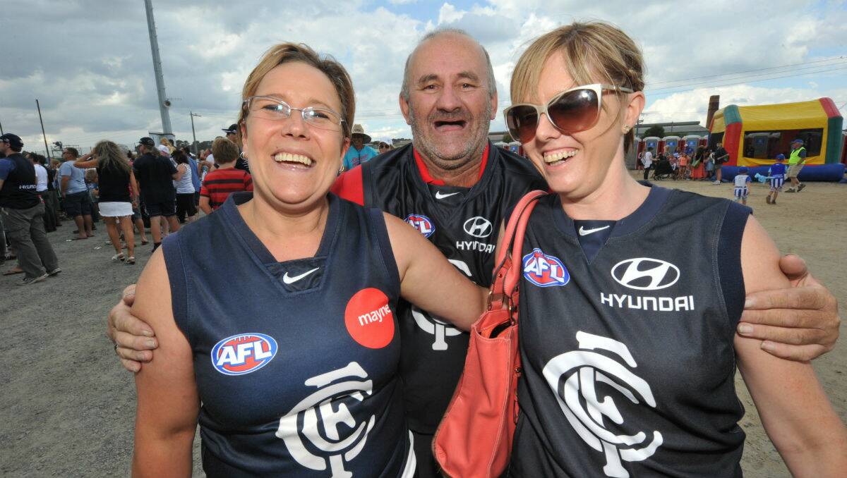 Mandy and Wendy Hucker with Dave Kenyon, behind, at Eureka Stadium. PICTURE: JEREMY BANNISTER