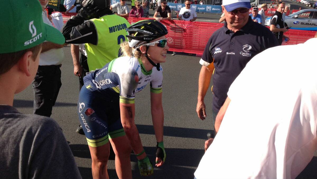 Annette Edmondson recovers after the crash in the elite women's criterium on Sturt Street. PICTURE: THE COURIER
