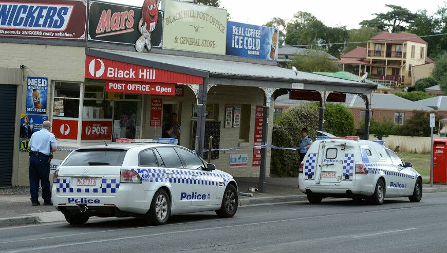 Police examine the scene of an armed robbery in Black Hill this afternoon. PICTURE: KATE HEALY