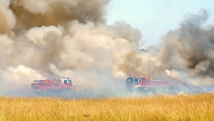 CFA officers fighting a grass fire at Smythes Creek earlier this week. PICTURE: JEREMY BANNISTER