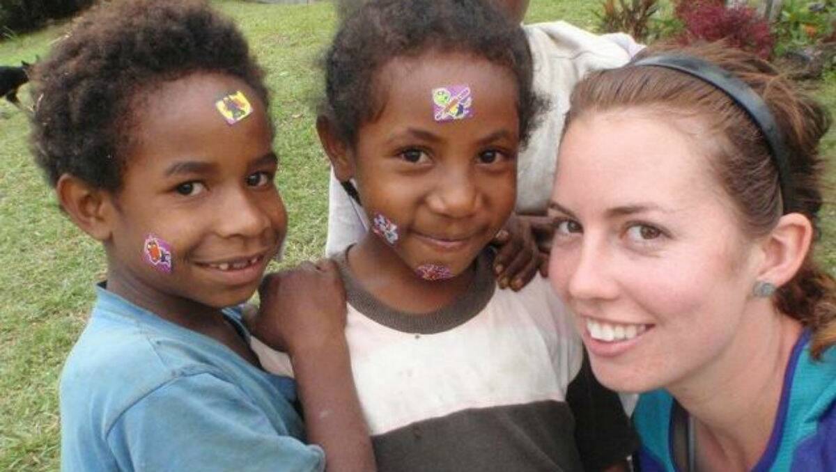 Megan Fraumano with Papua New Guinea children on a previous visit to the Kokoda Track. PICTURE: SUPPLIED