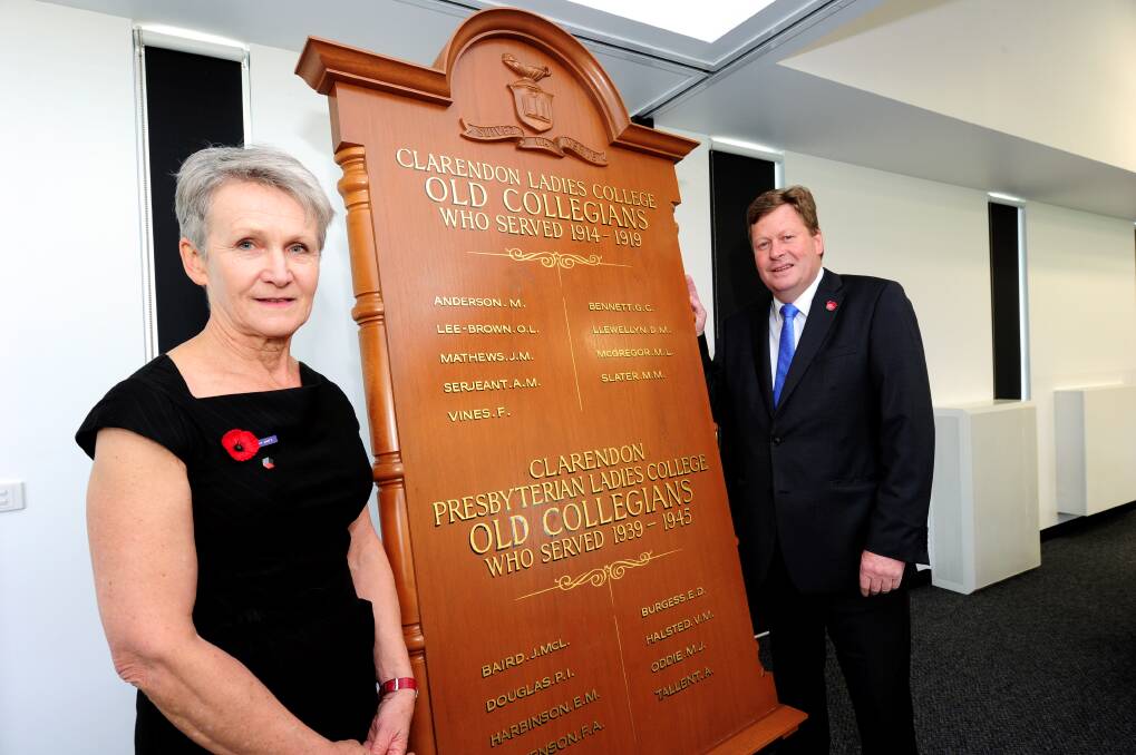 At the opening of the DJ Sewell Pavilion, Deputy principal Jan McLure and Senator Michael Ronaldson admire the new honour board. 