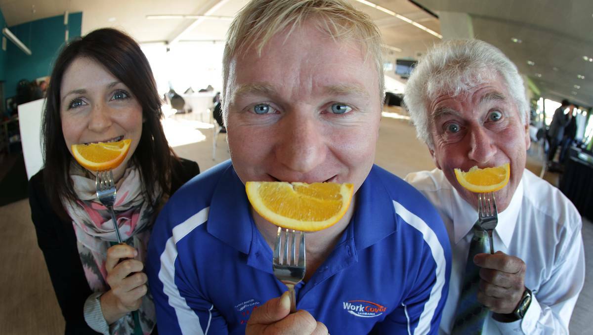 Dr Fiona Cocker, of the Menzies Research Institute, WorkCover health and well-being advisor Cameron Blight, and Daryl Peebles put their smiles on at a breakfast promoting positive mental health in Burnie this week. Pic: Grant Wells